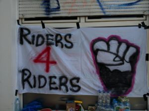 pancarta: riders for riders